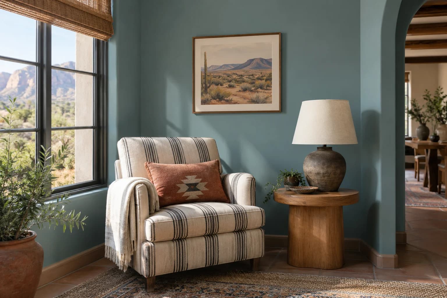 Reading nook with Aegean Teal walls and a cream armchair