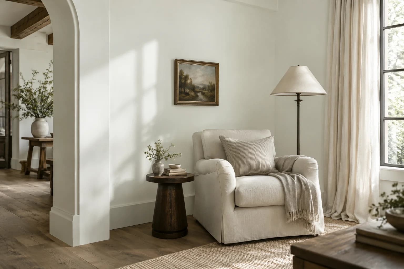 Reading nook with Chantilly Lace walls and a cream armchair