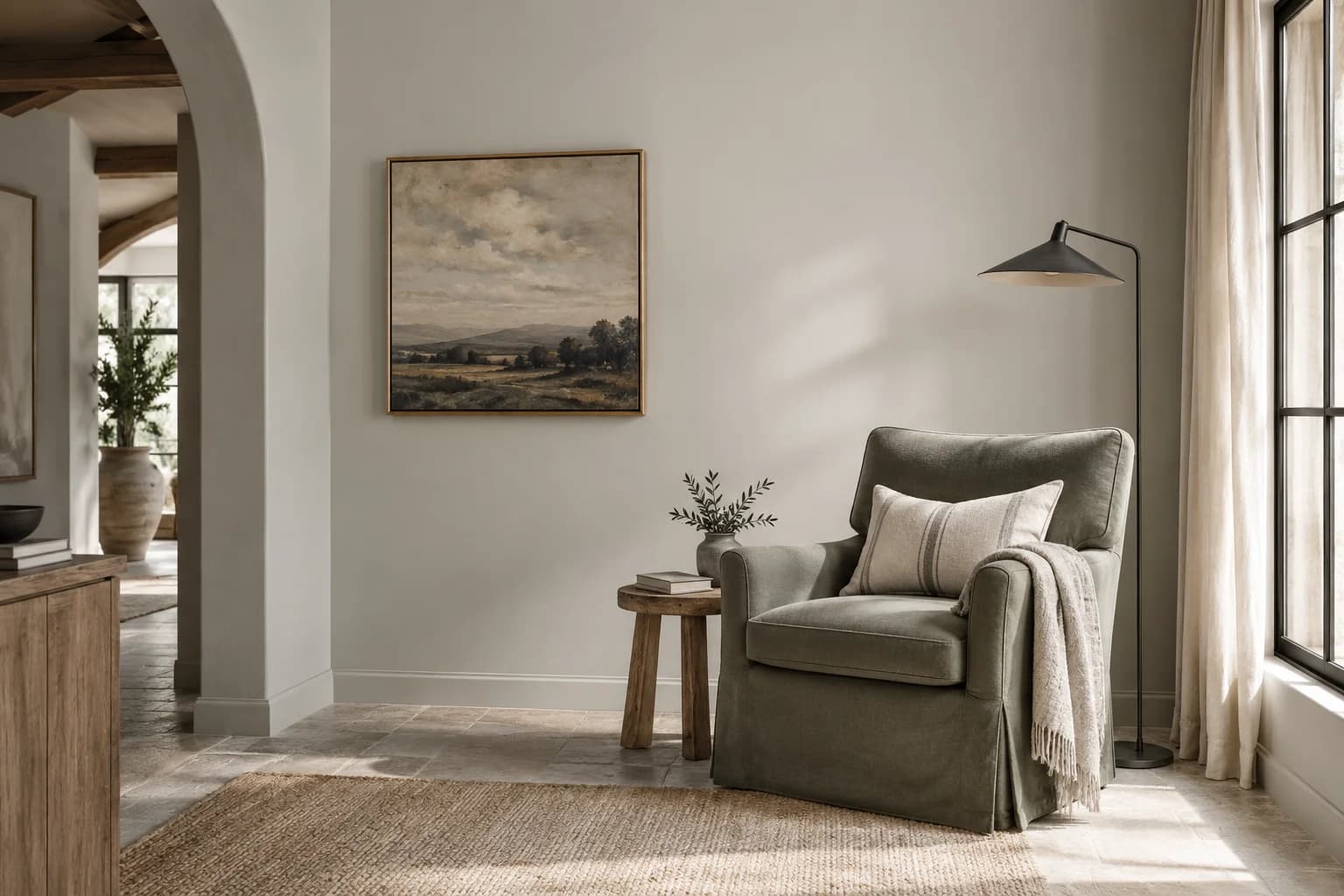 Reading nook with Tempered Gray walls and a cream armchair