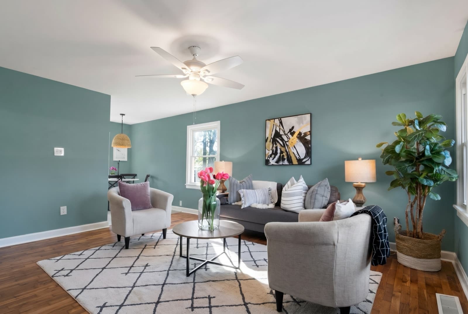 Living room repainted in Aegean Teal by Benjamin Moore