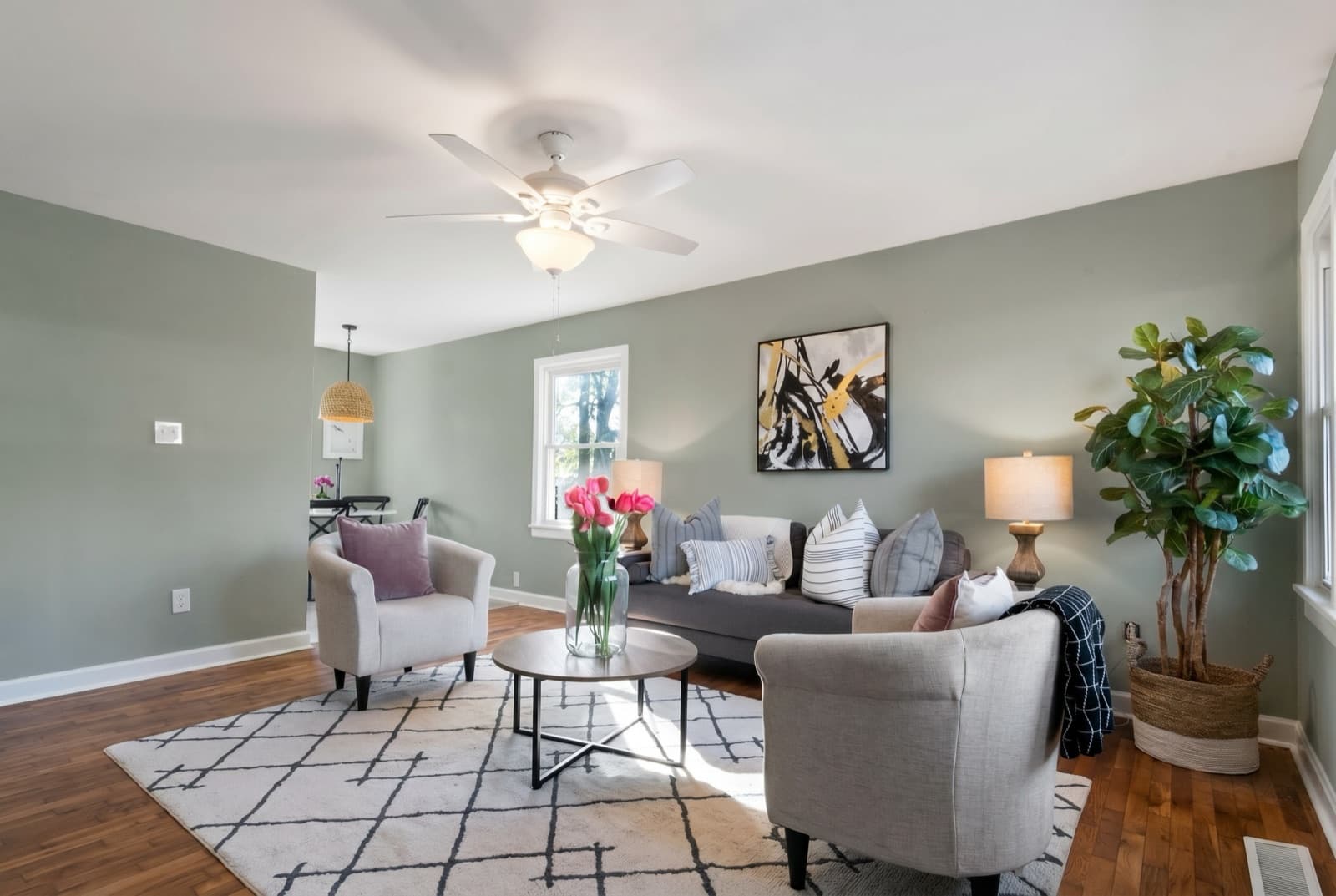 Living room repainted in Evergreen Fog by Sherwin-Williams