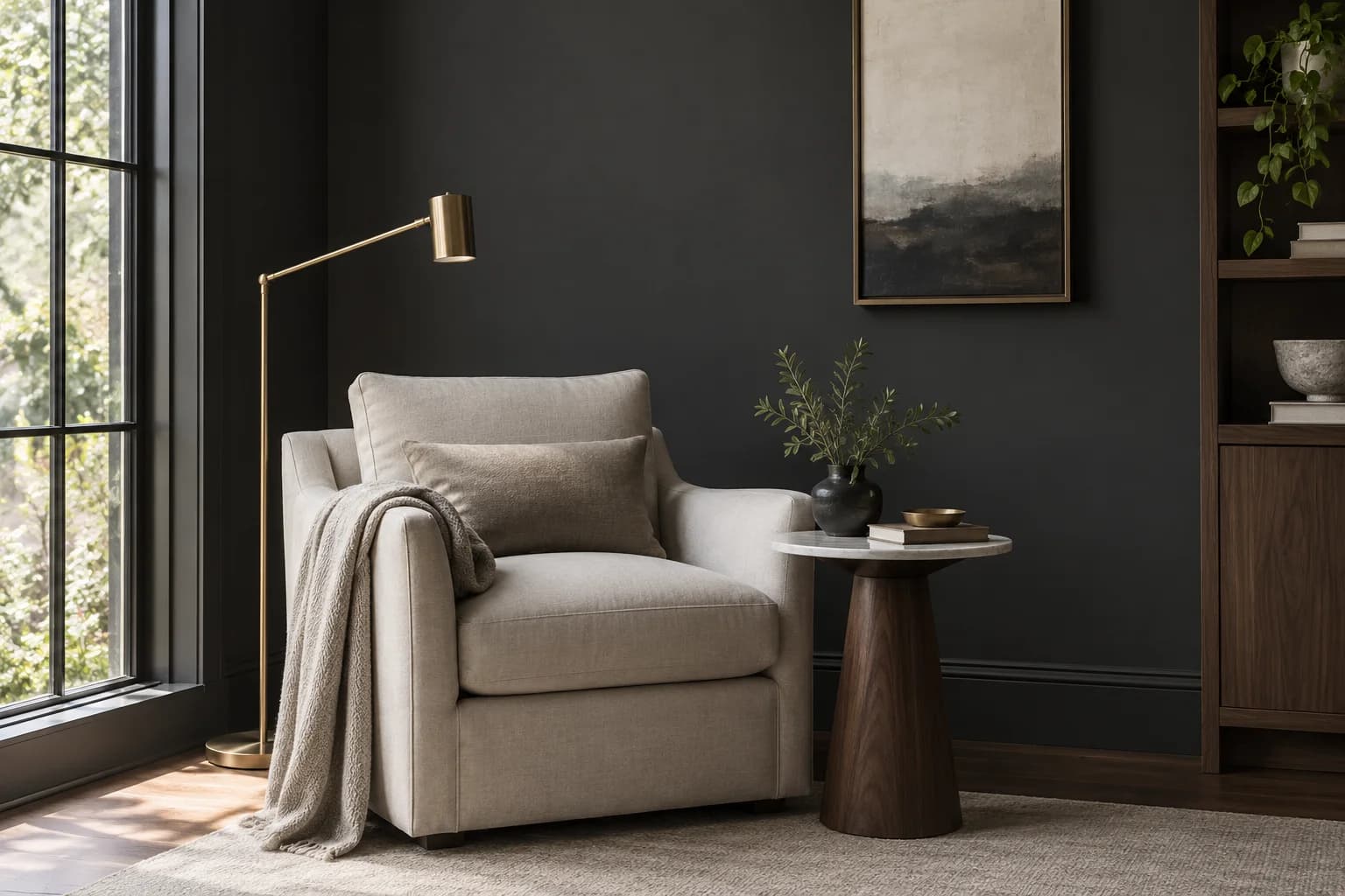 Reading nook with Black walls and a cream armchair