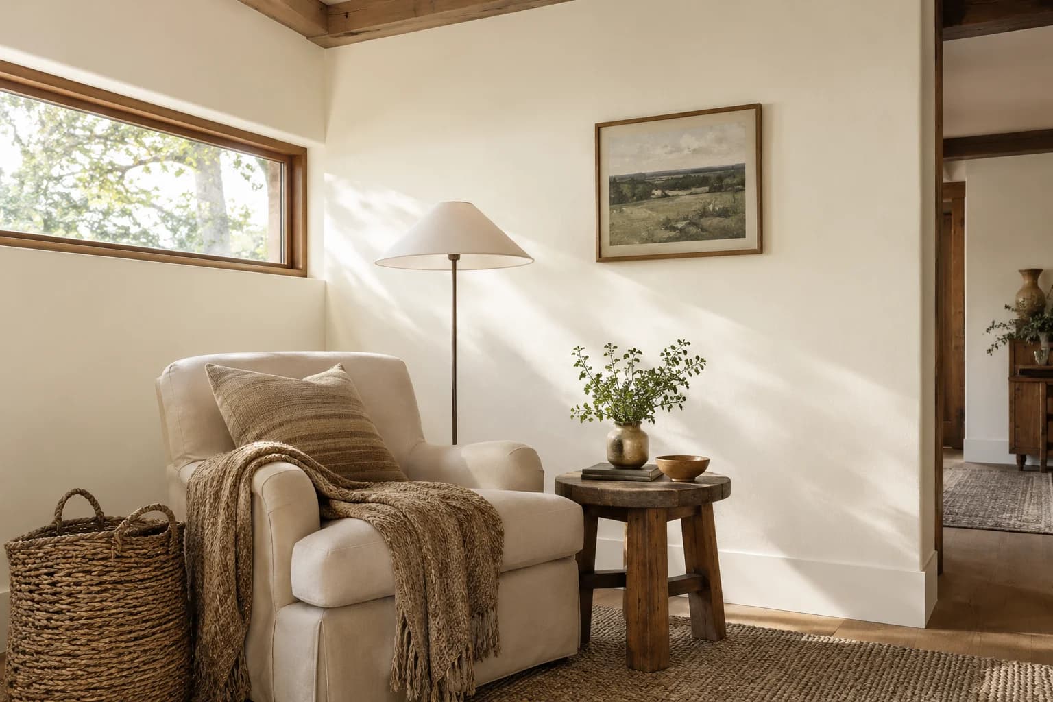 Reading nook with White Heat walls and a cream armchair