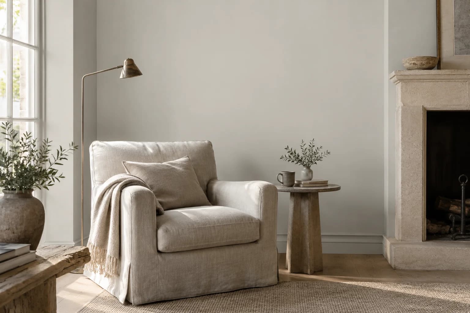 Reading nook with Ammonite walls and a cream armchair