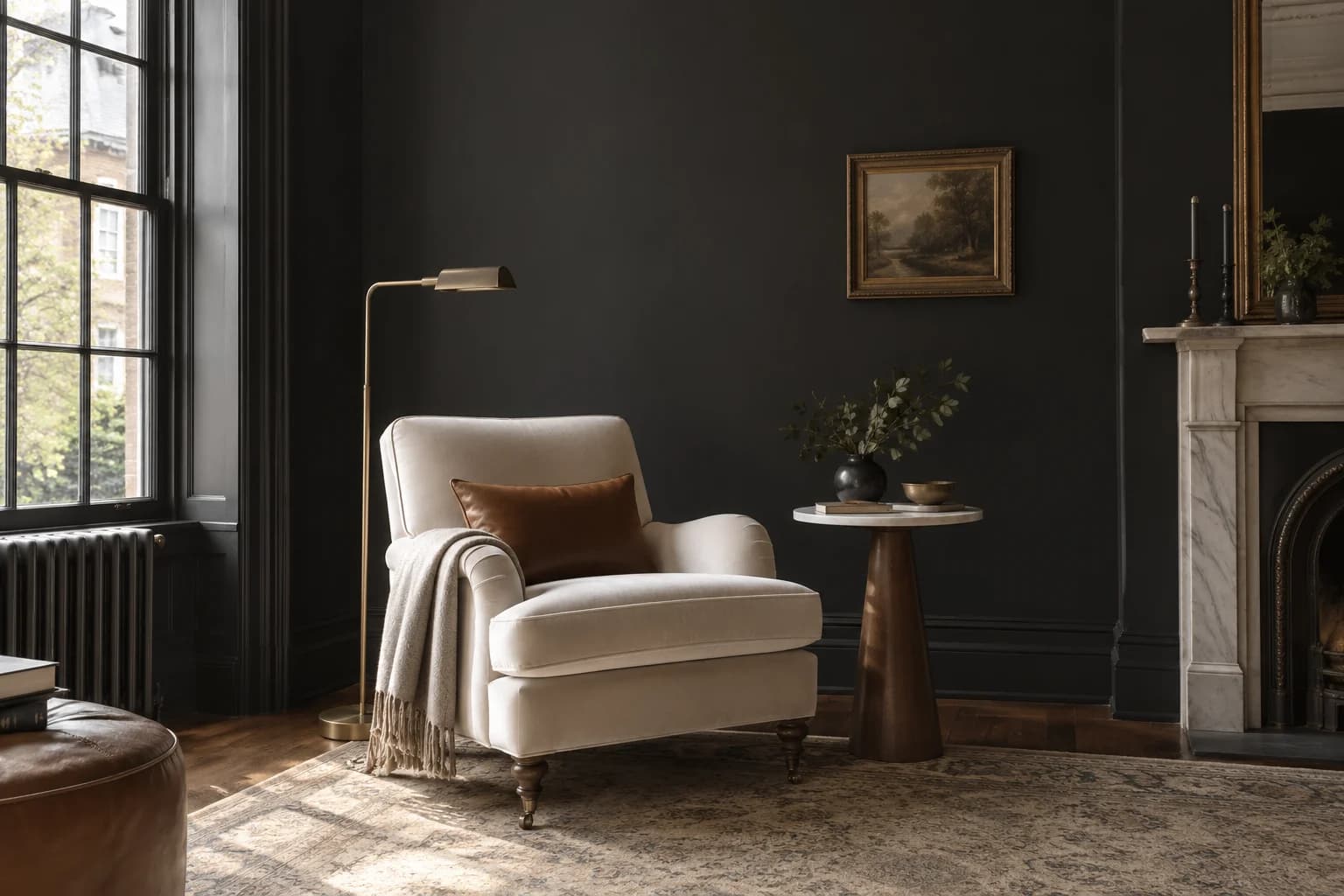 Reading nook with Black Magic walls and a cream armchair