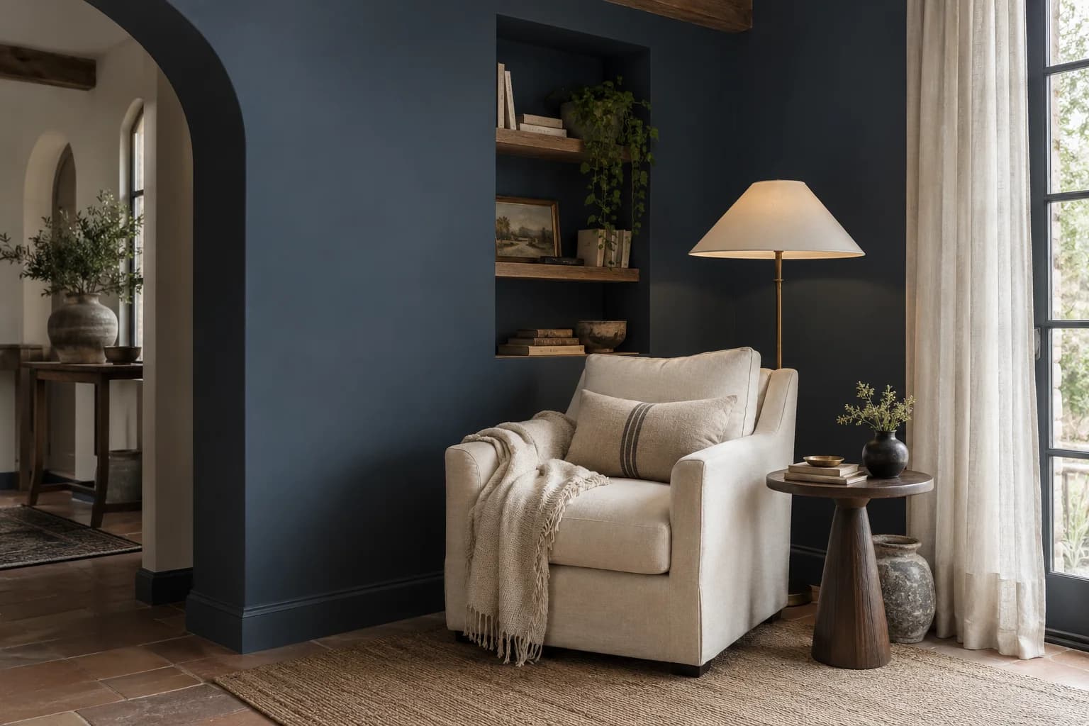 Reading nook with Naval walls and a cream armchair