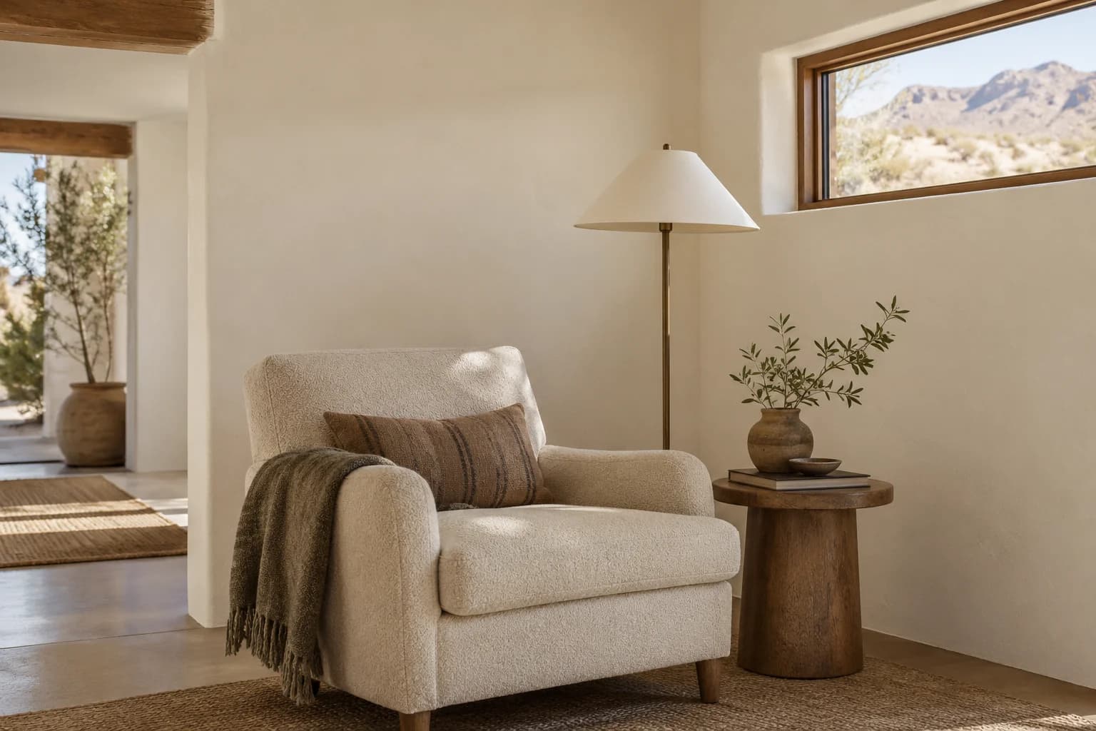 Reading nook with Cozy White walls and a cream armchair